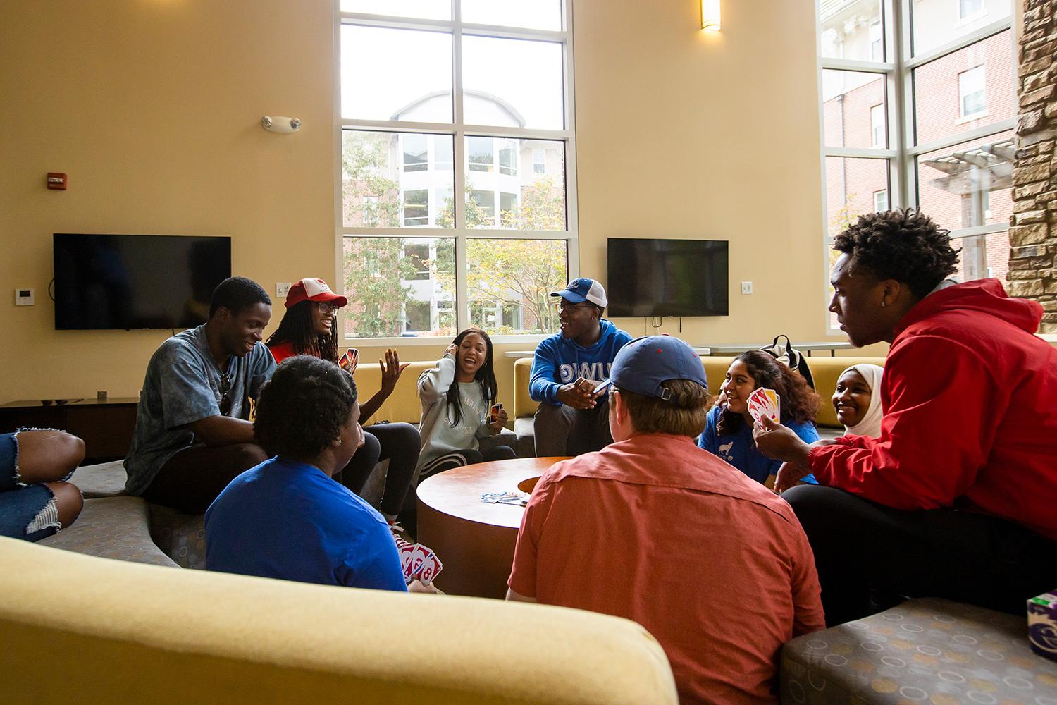 Two students in a residence hall room.